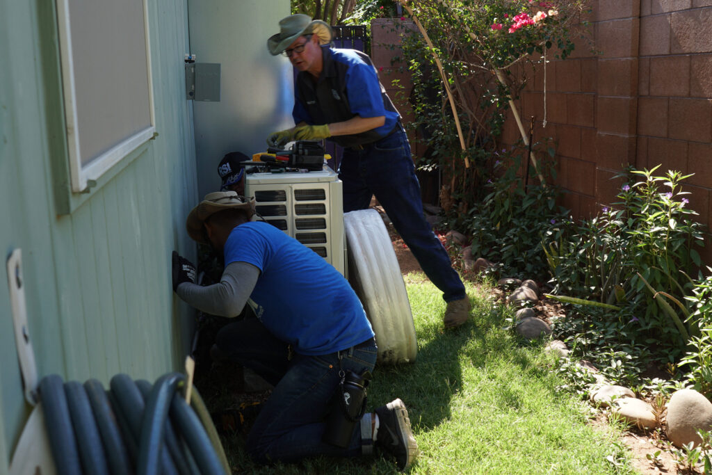 RSI HVAC technicians installing outdoor system